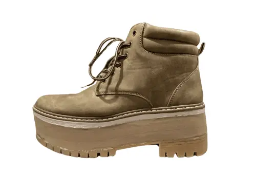 Work boot with a tall custom shoe lift built into the sole